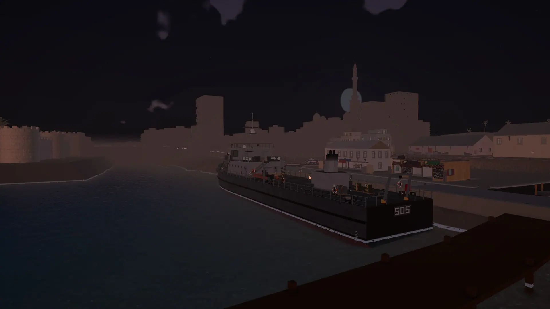 A ship moored in the harbour at night